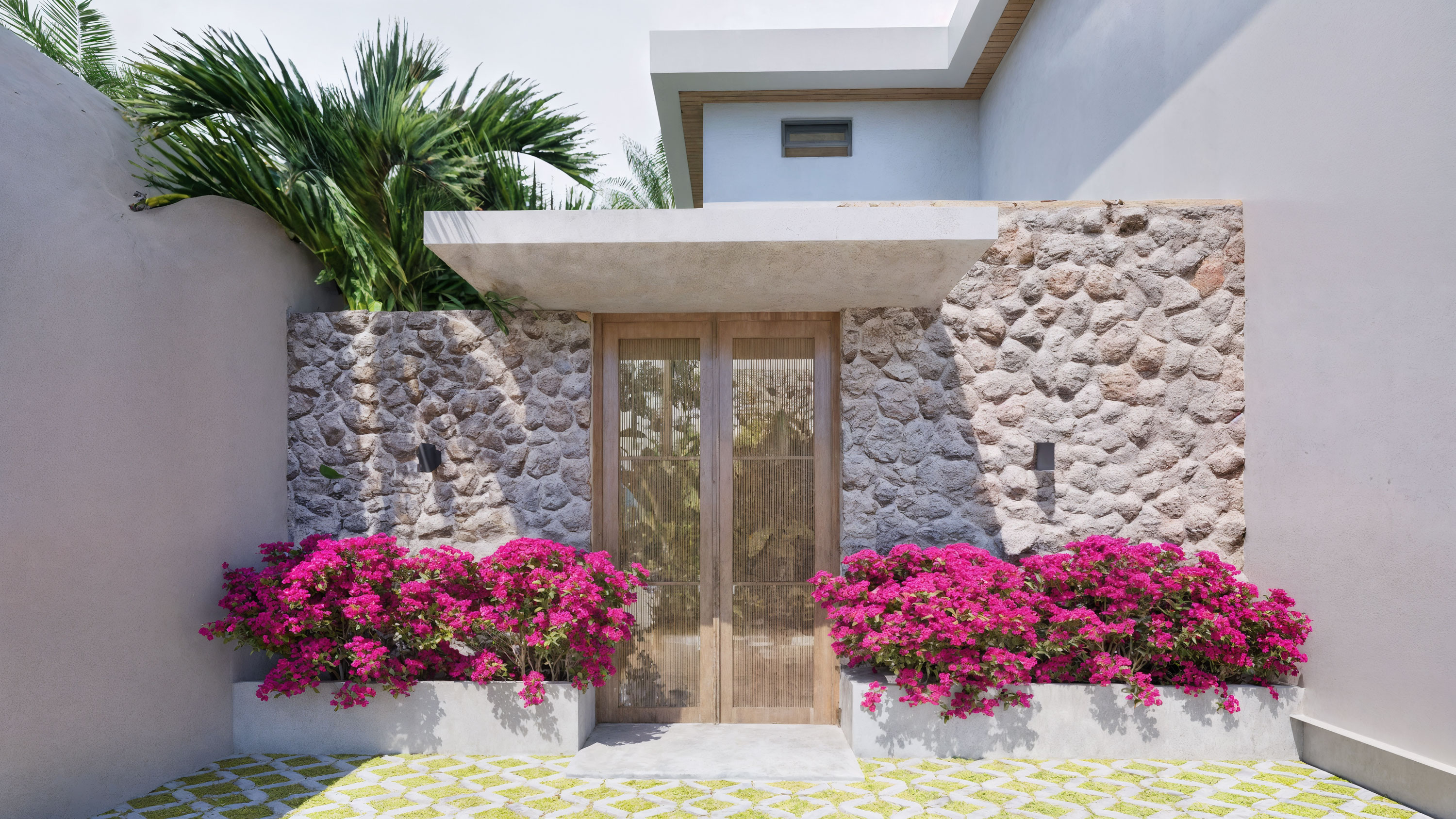 Villa entrance — stone wall and bougainvillea